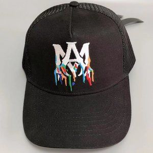 The AMIRI logo is embroidered on a black trucker hat